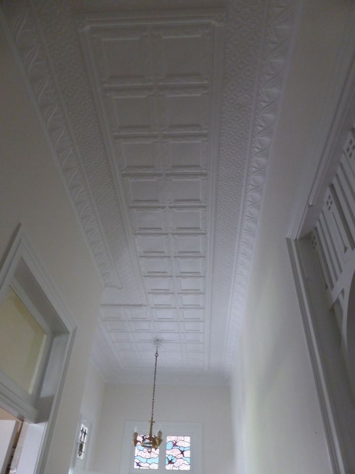Pressed metal ceiling and pendant light after painting