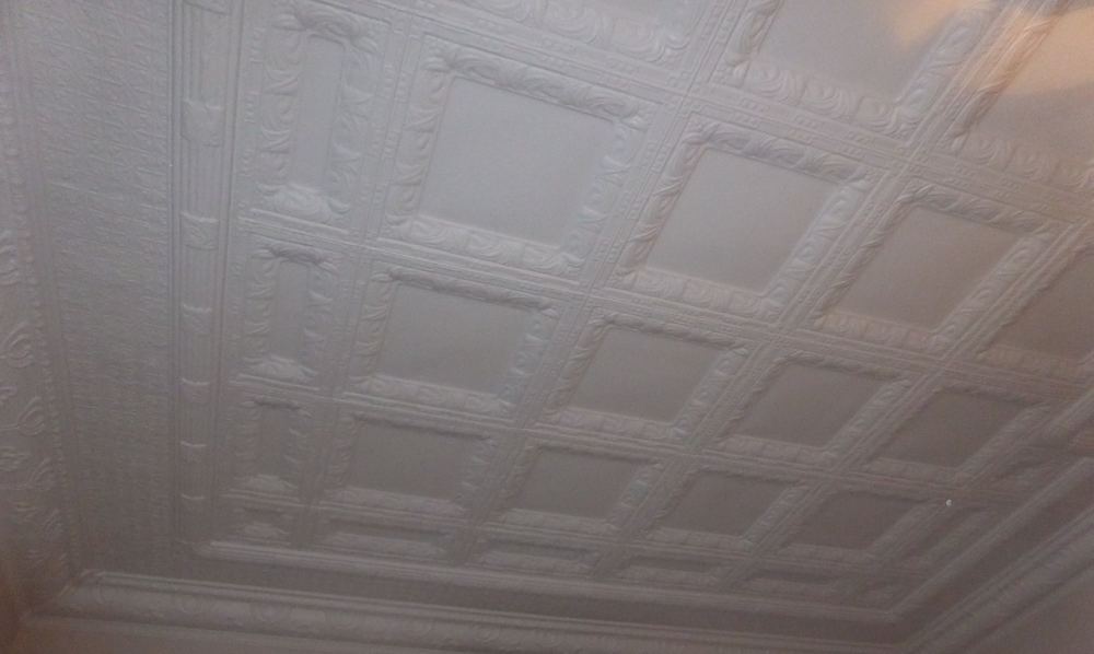 Pressed metal ceiling repainted white