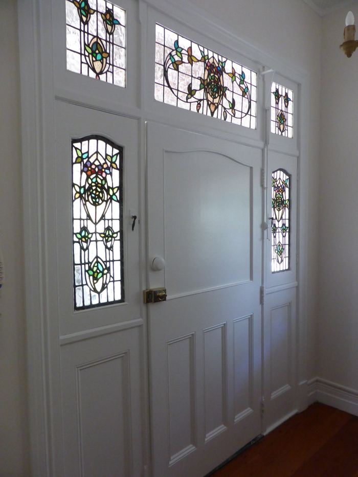 Clayfield front entry doors in white with leadlight panels