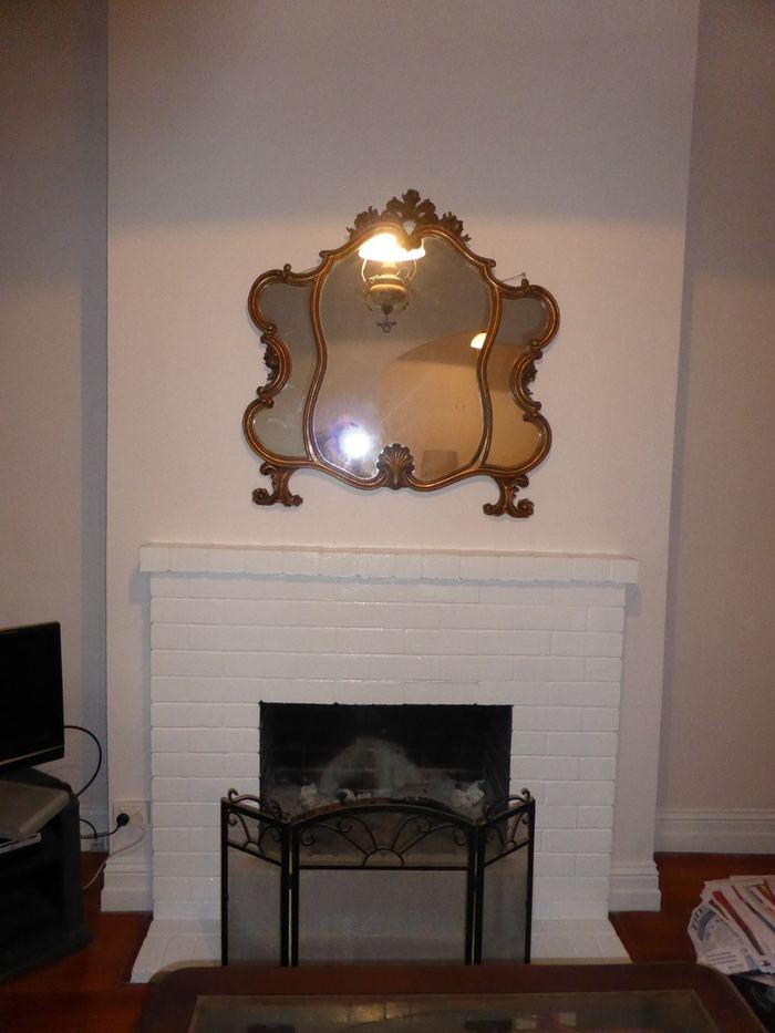 The same Clayfield fireplace after painting, surround and walls in white