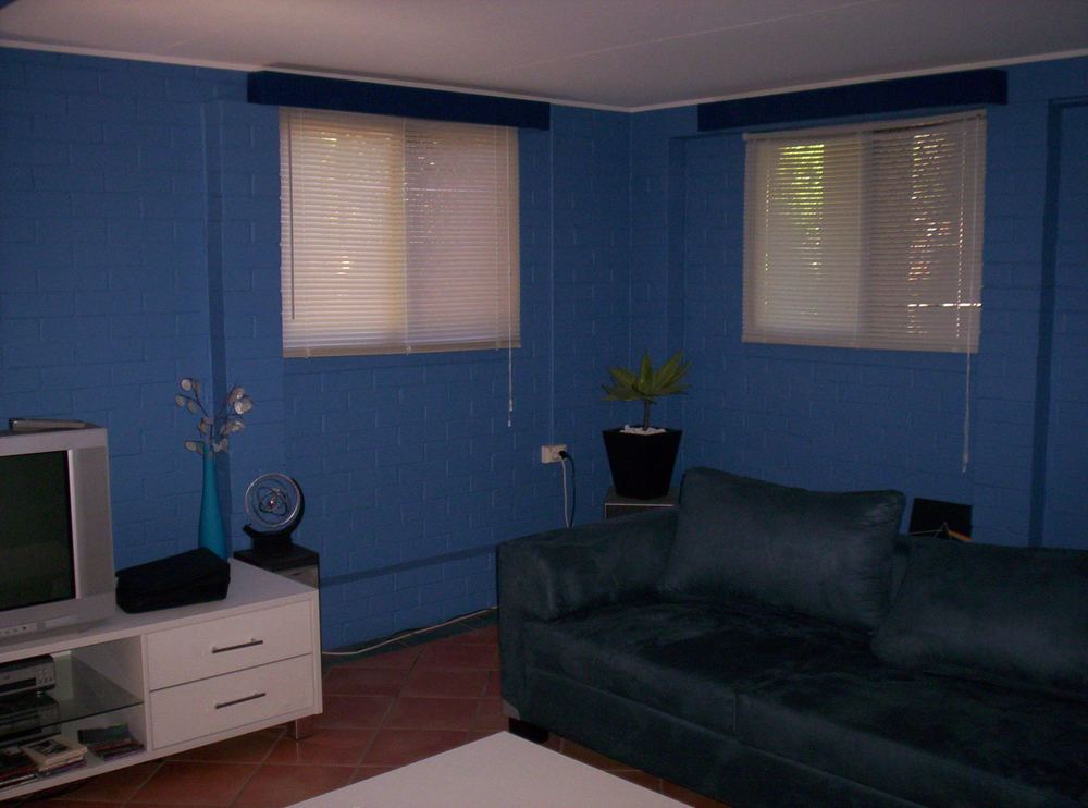 The same Lawnton rumpus room finished in deep blue with a navy pelmet