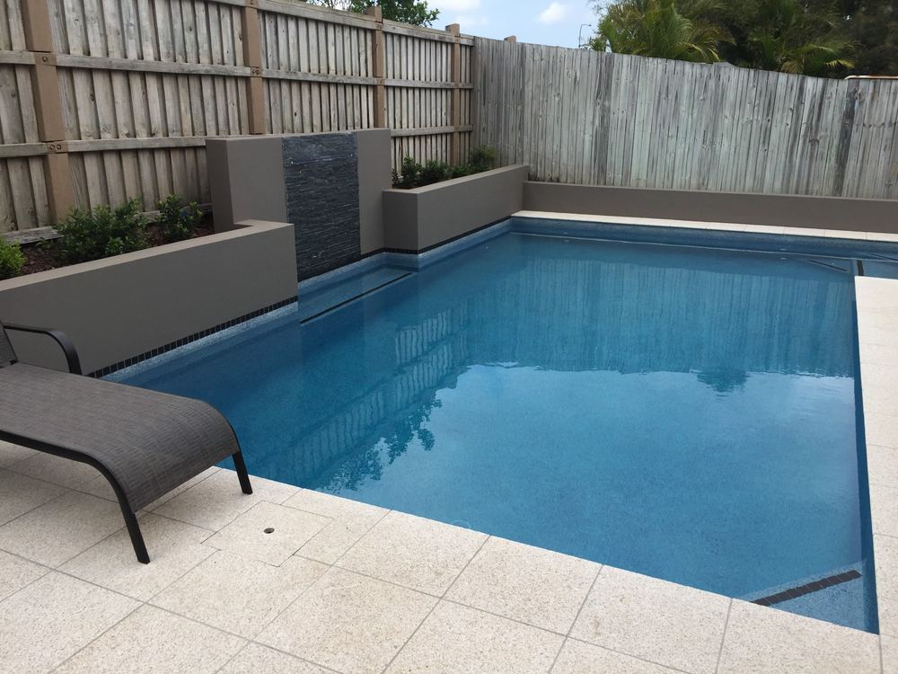 Painted retaining wall around a new pool in North Lakes